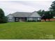 Charming blue single story home featuring a well-manicured lawn and traditional design at 4330 Goodman Lake Rd, Salisbury, NC 28146