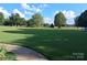 Large, manicured front yard with a lush green lawn, providing a welcoming approach to the property at 4330 Goodman Lake Rd, Salisbury, NC 28146