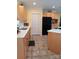 Clean kitchen with light wood cabinets, tile floors, and plenty of counter space at 4330 Goodman Lake Rd, Salisbury, NC 28146