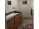 Functional laundry room with cabinetry, sink, and washer/dryer hookups for added convenience at 4330 Goodman Lake Rd, Salisbury, NC 28146