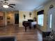 Spacious living room with wood flooring and piano at 4330 Goodman Lake Rd, Salisbury, NC 28146