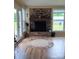 Living room featuring wood floors and brick fireplace at 4330 Goodman Lake Rd, Salisbury, NC 28146