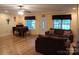 Cozy living room with hardwood floors, lots of natural light and comfortable seating at 4330 Goodman Lake Rd, Salisbury, NC 28146