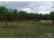 Beautiful property featuring a serene pond and a relaxing swing at 4330 Goodman Lake Rd, Salisbury, NC 28146