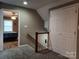 Upstairs hallway with carpeted floors and a view into another bedroom at 4330 Goodman Lake Rd, Salisbury, NC 28146