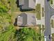 Aerial view showcases a home, expansive yard, and neighborhood trees from above at 4607 Walking Path Dr, Waxhaw, NC 28173