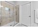 Bright shower room with a glass door, neutral tile, and a clean, modern aesthetic at 4607 Walking Path Dr, Waxhaw, NC 28173
