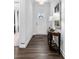 Hallway with dark wood floors, decorative lamps, and access to other rooms in the house at 4607 Walking Path Dr, Waxhaw, NC 28173