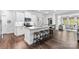 Spacious open kitchen featuring granite counters, stainless appliances and an island with bar stool seating at 4607 Walking Path Dr, Waxhaw, NC 28173