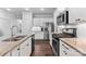 Modern kitchen featuring stainless steel appliances, granite countertops, and wood floors at 4607 Walking Path Dr, Waxhaw, NC 28173
