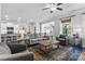 Bright living room with a ceiling fan, stylish furniture, and an adjacent kitchen area at 4607 Walking Path Dr, Waxhaw, NC 28173