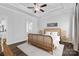 Bedroom featuring a decorative ceiling, light hardwood floors, and natural light from the windows at 4607 Walking Path Dr, Waxhaw, NC 28173