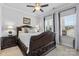 Bedroom featuring a dark wood sleigh bed, carpet, and a window with natural light at 4607 Walking Path Dr, Waxhaw, NC 28173