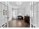Office space with French doors, wood flooring, and a desk, offering a professional and comfortable work environment at 4607 Walking Path Dr, Waxhaw, NC 28173