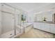 Stylish bathroom with glass shower, soaking tub, and double vanity with granite countertops at 5028 Whitemarsh Ct, Indian Land, SC 29720