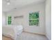 Inviting bedroom features soft carpet, two windows with backyard views, and a comfortable bed at 5028 Whitemarsh Ct, Indian Land, SC 29720