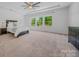 Spacious main bedroom with windows, carpet flooring, ceiling fan, and closet at 5028 Whitemarsh Ct, Indian Land, SC 29720