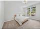 Cozy bedroom with white walls, carpet floors, natural light and a queen bed at 5028 Whitemarsh Ct, Indian Land, SC 29720