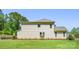 A side view of a two-story house with a well-manicured lawn and mature landscaping at 5028 Whitemarsh Ct, Indian Land, SC 29720