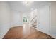 Spacious foyer with hardwood floors, staircase, and plenty of natural light, creating a welcoming entrance at 5028 Whitemarsh Ct, Indian Land, SC 29720