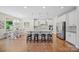 Bright open-concept kitchen with large island, breakfast bar, stainless appliances, and granite countertops at 5028 Whitemarsh Ct, Indian Land, SC 29720