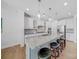 Modern kitchen with granite countertops, stainless steel appliances, large island and pendant lights at 5028 Whitemarsh Ct, Indian Land, SC 29720