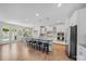 Open-concept kitchen featuring granite countertops, stainless steel appliances, and a large island at 5028 Whitemarsh Ct, Indian Land, SC 29720