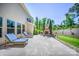 A stone patio with outdoor furniture and fireplace, perfect for entertaining or relaxing outdoors at 5028 Whitemarsh Ct, Indian Land, SC 29720