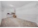 Large storage room with carpet flooring, shelving, and great storage capacity at 5028 Whitemarsh Ct, Indian Land, SC 29720