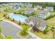 Aerial view showcasing community pool area and recreation center with ample parking in a well-maintained community at 5028 Whitemarsh Ct, Lancaster, SC 29720