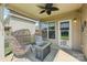 Cozy back porch with two egg chairs and a modern coffee table at 5037 Nighthawk Dr, Fort Mill, SC 29707