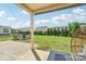 Back yard featuring a grass lawn, patio, and chairs for outdoor entertaining at 5037 Nighthawk Dr, Fort Mill, SC 29707