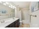 Bathroom with double vanity, tile floor, and shower-tub combo, designed for comfort and functionality at 5037 Nighthawk Dr, Fort Mill, SC 29707
