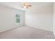 Bright bedroom features a ceiling fan and a window letting in natural light at 5037 Nighthawk Dr, Fort Mill, SC 29707