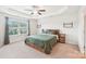 Bedroom featuring a tray ceiling, ceiling fan, and a large window at 5037 Nighthawk Dr, Fort Mill, SC 29707