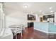 Open-concept dining area features bench seating, a wood dining table, and access to the kitchen with bar seating at 5037 Nighthawk Dr, Fort Mill, SC 29707