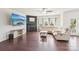 Comfortable living room with hardwood floors, a fireplace, and a large sectional sofa at 5037 Nighthawk Dr, Fort Mill, SC 29707
