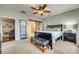 Charming bedroom with fan, access to ensuite bathroom and view of the living room at 5050 Kinross Ln, Indian Land, SC 29707