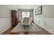 Elegant dining room featuring crown molding, a decorative rug, and ample natural light at 5050 Kinross Ln, Indian Land, SC 29707