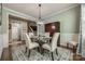 Well-decorated dining room featuring crown molding, a chandelier, and hardwood floors at 5050 Kinross Ln, Indian Land, SC 29707