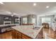 Spacious kitchen with island, granite counters, stainless steel sink and hardwood floors at 5050 Kinross Ln, Indian Land, SC 29707