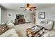 Large, sunlit living room featuring carpet floors, ceiling fan and comfortable seating at 5050 Kinross Ln, Indian Land, SC 29707