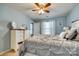 Cozy main bedroom with ceiling fan, neutral colored walls, and a large dresser at 5050 Kinross Ln, Indian Land, SC 29707