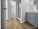 Bathroom features wood-look floors, vanity, and a glass door shower at 508 Danfield Dr, Clover, SC 29710