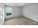 The bedroom has neutral carpet and a bright window, offering a clean and inviting space at 508 Danfield Dr, Clover, SC 29710