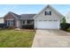 Charming single-Gathering home features a two-car garage, well-maintained lawn, and inviting curb appeal at 508 Danfield Dr, Clover, SC 29710