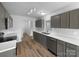 Modern kitchen features gray cabinets, stainless appliances, and hard wood flooring at 508 Danfield Dr, Clover, SC 29710