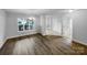 The bright living room boasts hardwood floors and a large window with neighborhood views at 508 Danfield Dr, Clover, SC 29710
