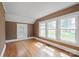 Bedroom with hardwood floors, multiple windows, and trim at 627 N Flint St, Lincolnton, NC 28092