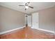 Bedroom with hardwood floors, neutral walls, a ceiling fan and a double door closet at 627 N Flint St, Lincolnton, NC 28092